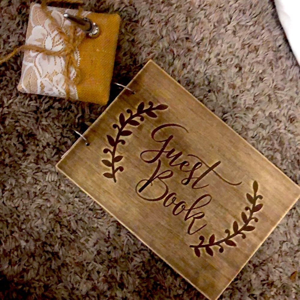 Guest book pen and stand with pages inside